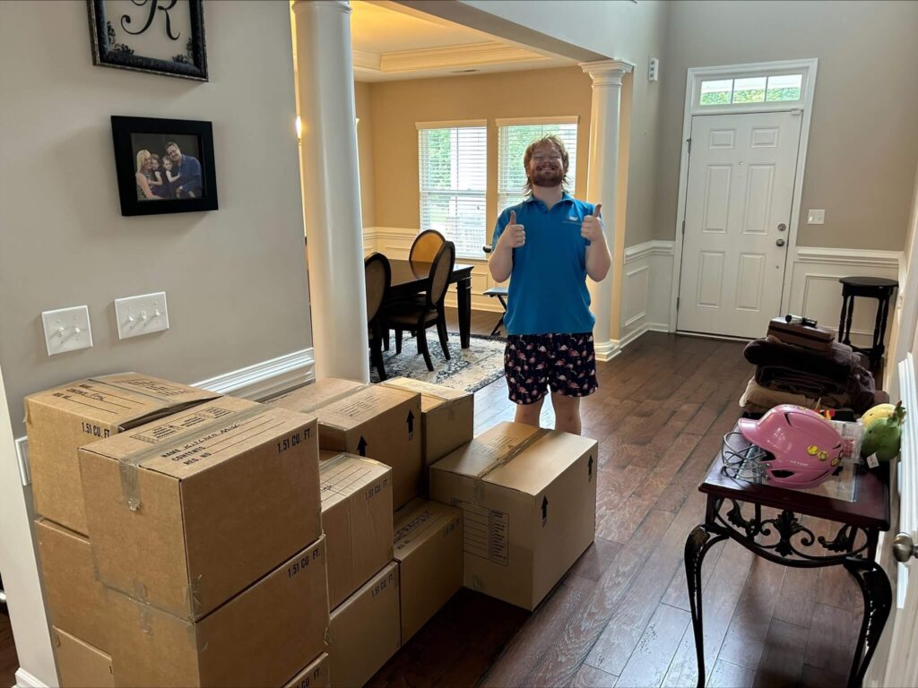 MovePlus movers loading furniture and boxes for transport