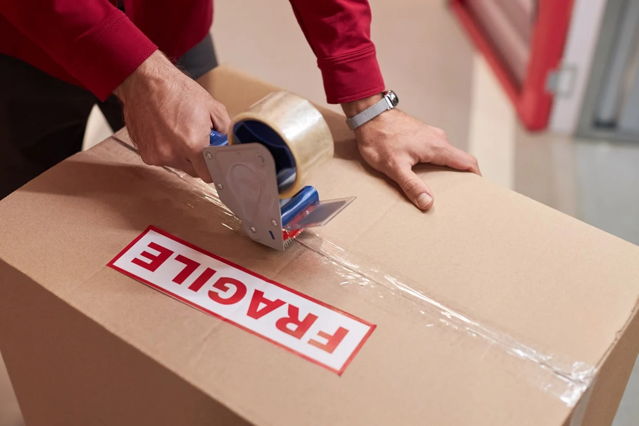 MovePlus movers carrying boxes during a relocation