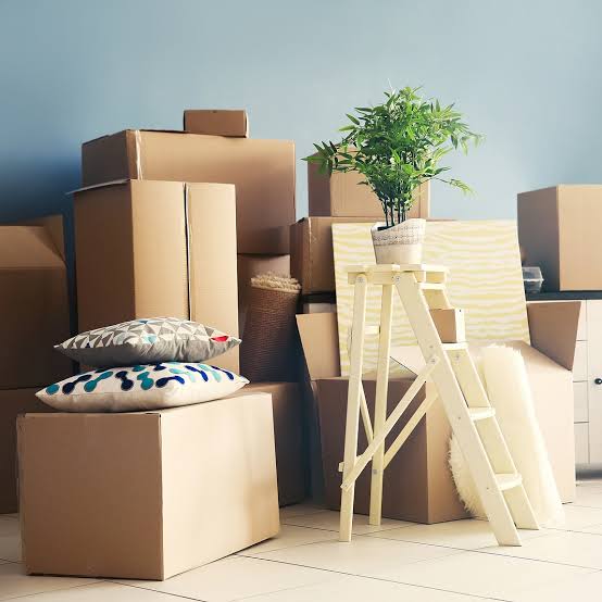 MovePlus moving team organizing household belongings before transport